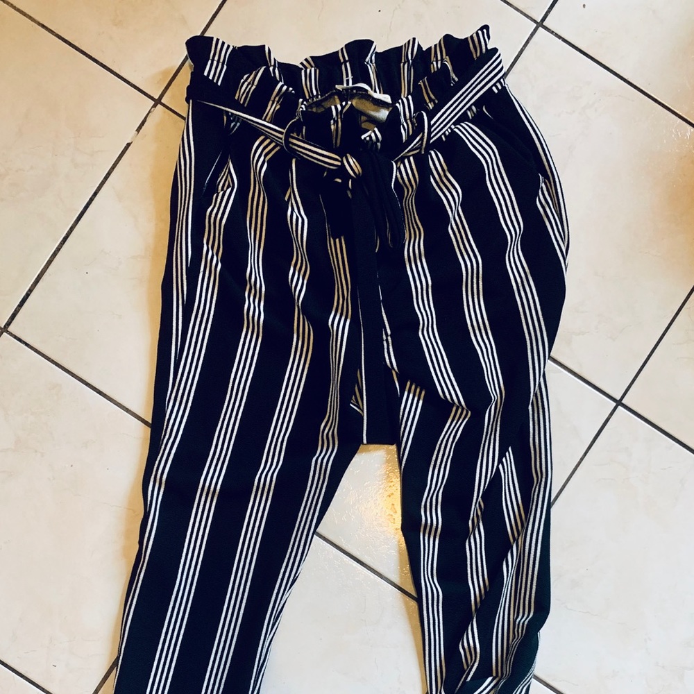 Black and white striped pants.